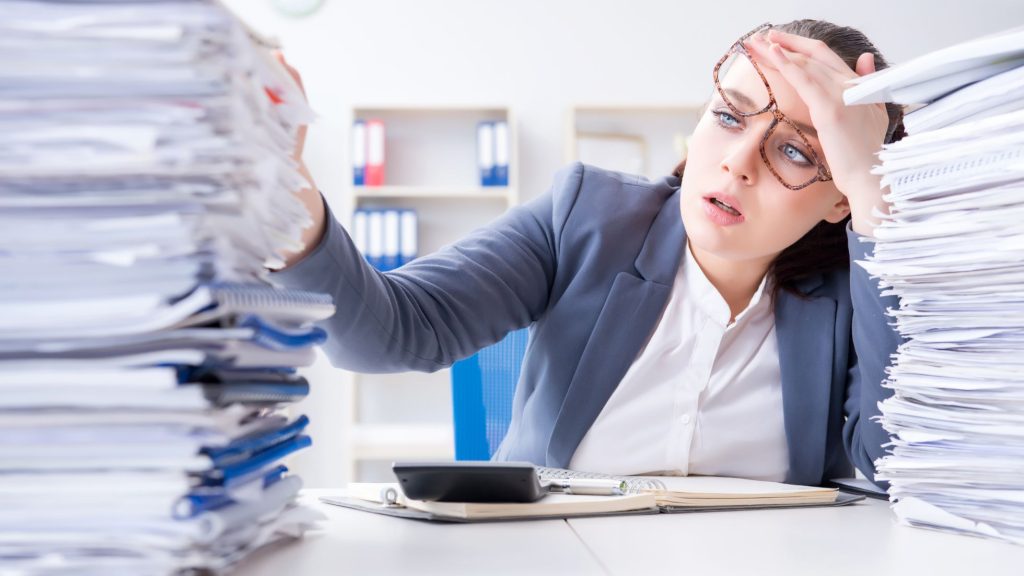 stock image representing someone overwhelmed with documents from a subject acces requets